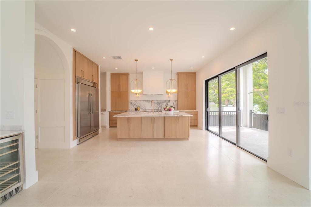 4502 South Shamrock Road Tampa, FL 33611 - Photo 22 of 41 a large white kitchen with a large window