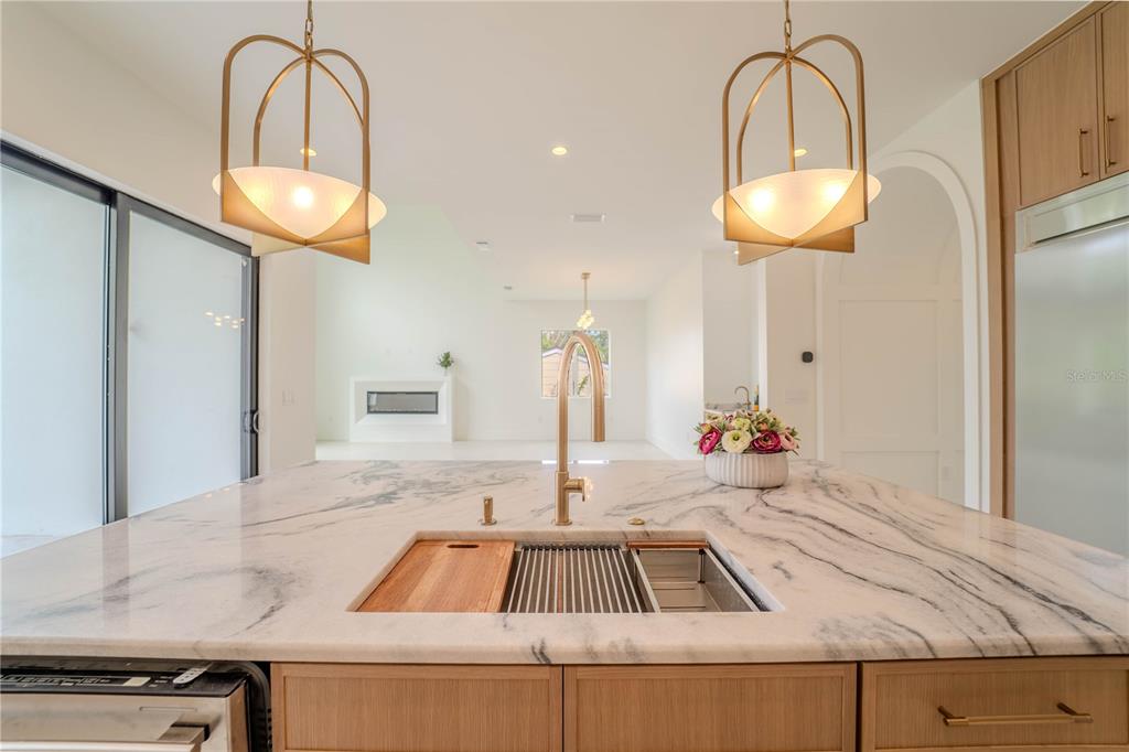 4502 South Shamrock Road Tampa, FL 33611 - Photo 23 of 41 a kitchen with kitchen island a counter and a sink