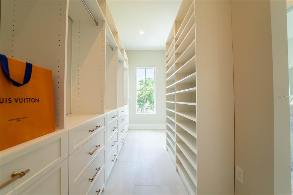 4502 South Shamrock Road Tampa, FL 33611 - Photo 37 of 41 a view of walk in closet with empty racks