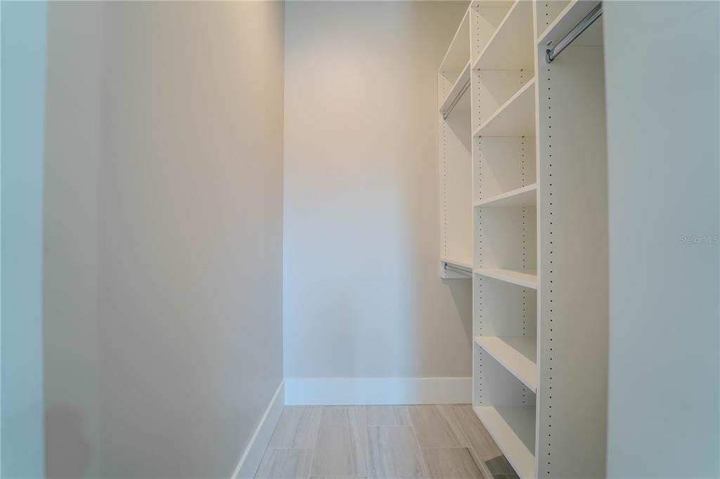 4502 South Shamrock Road Tampa, FL 33611 - Photo 39 of 41 a view of walk in closet with empty racks