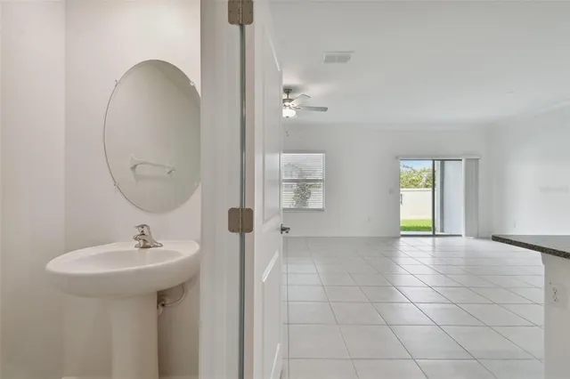 a kitchen with granite countertop a sink and cabinets