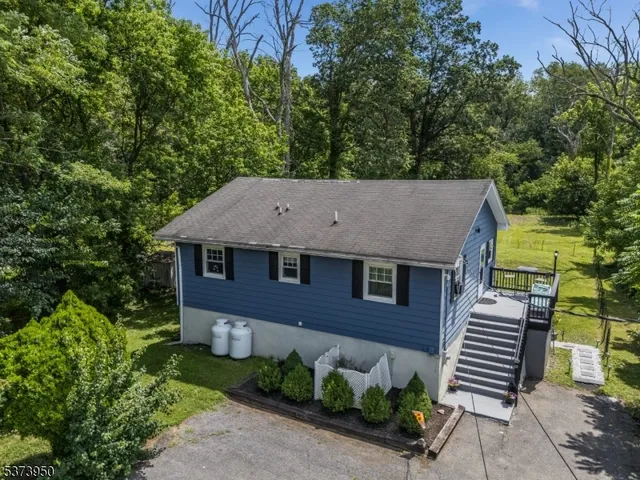 an aerial view of a house with garden