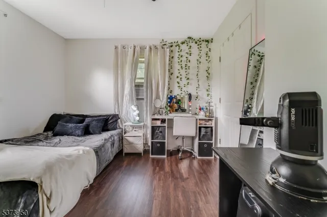 a bedroom with a bed and a table in it