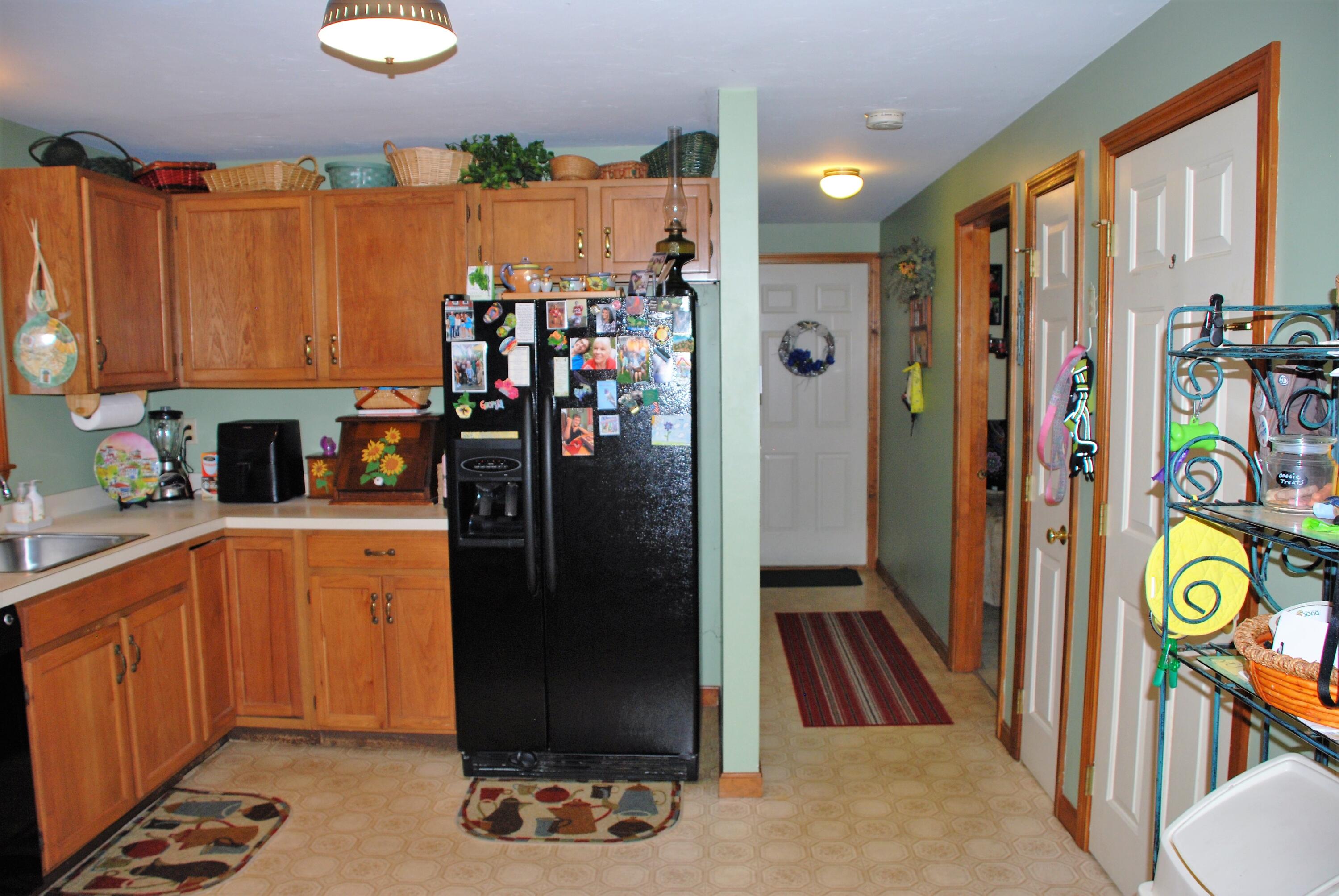 16 Skipjack Lane Hyannis, MA 02601 - Photo 11 of 39 a kitchen with stainless steel appliances granite countertop a refrigerator and a sink