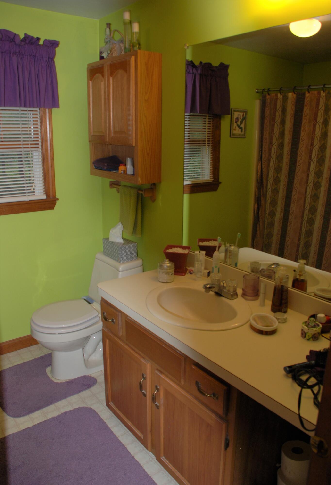 16 Skipjack Lane Hyannis, MA 02601 - Photo 18 of 39 a bathroom with a sink a toilet and mirror