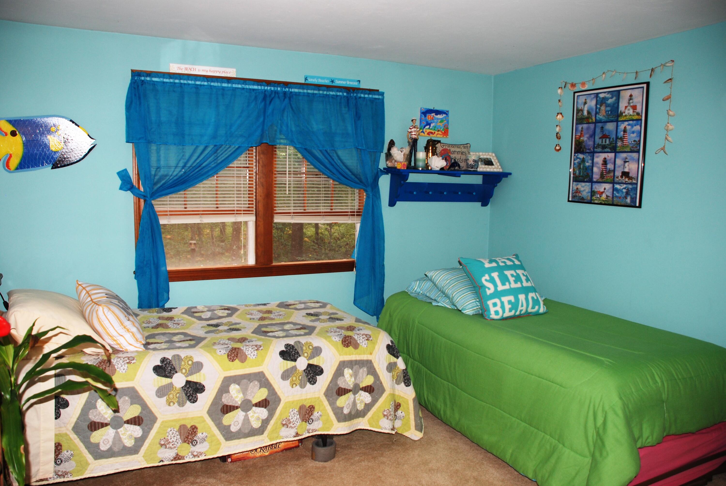 16 Skipjack Lane Hyannis, MA 02601 - Photo 19 of 39 a bedroom with a bed and dresser