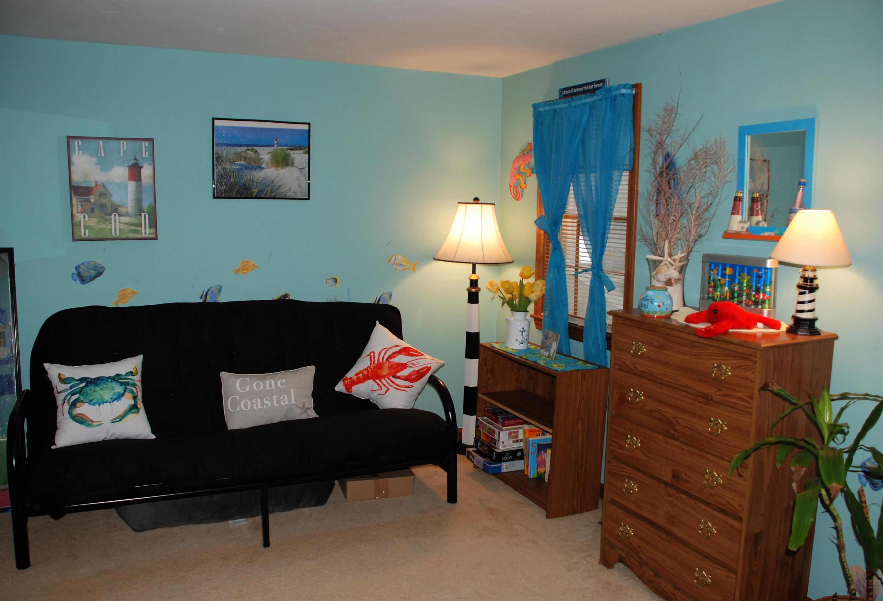 16 Skipjack Lane Hyannis, MA 02601 - Photo 20 of 39 a living room with furniture and a baby crib