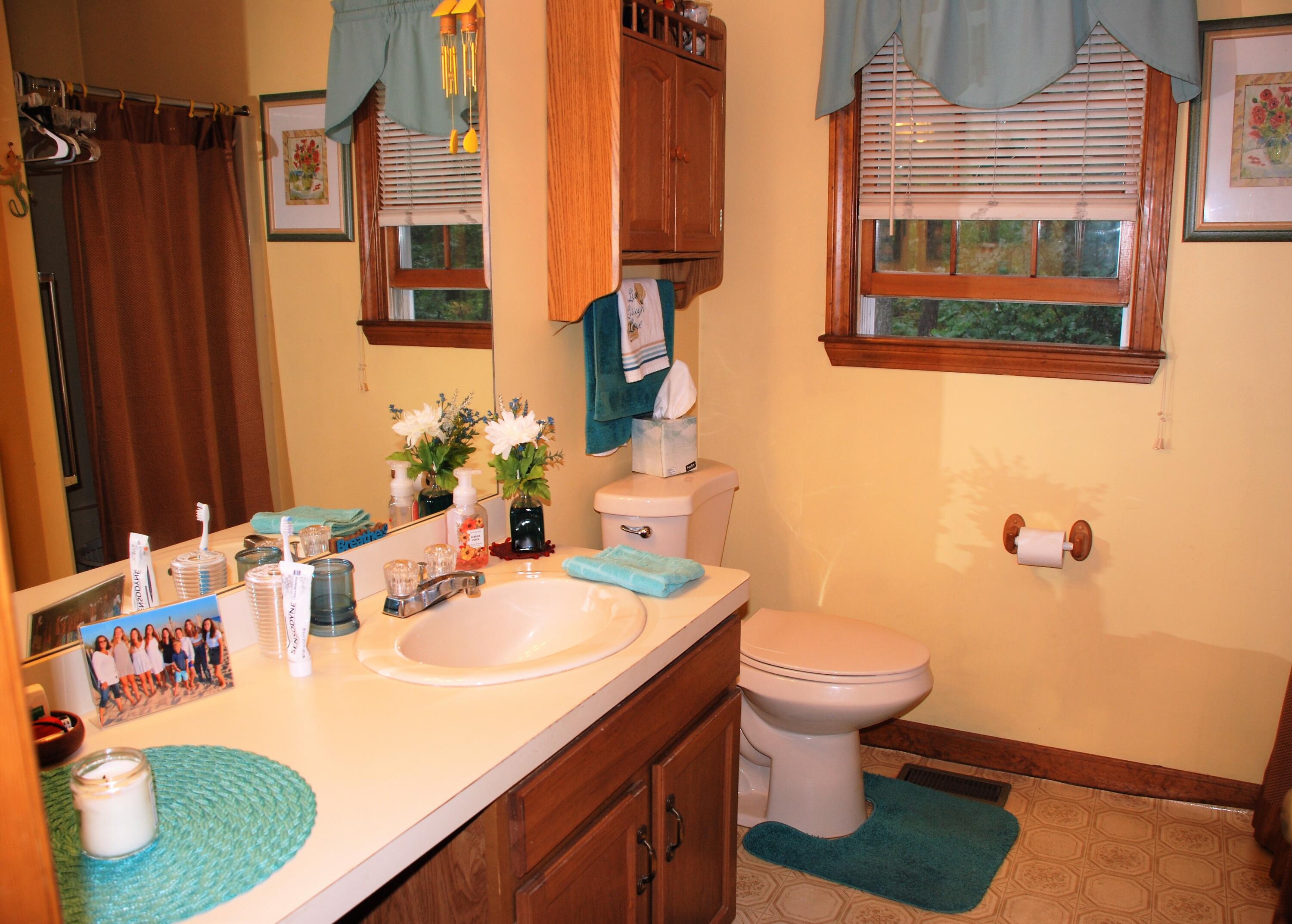 16 Skipjack Lane Hyannis, MA 02601 - Photo 23 of 39 a bathroom with a sink toilet and a mirror