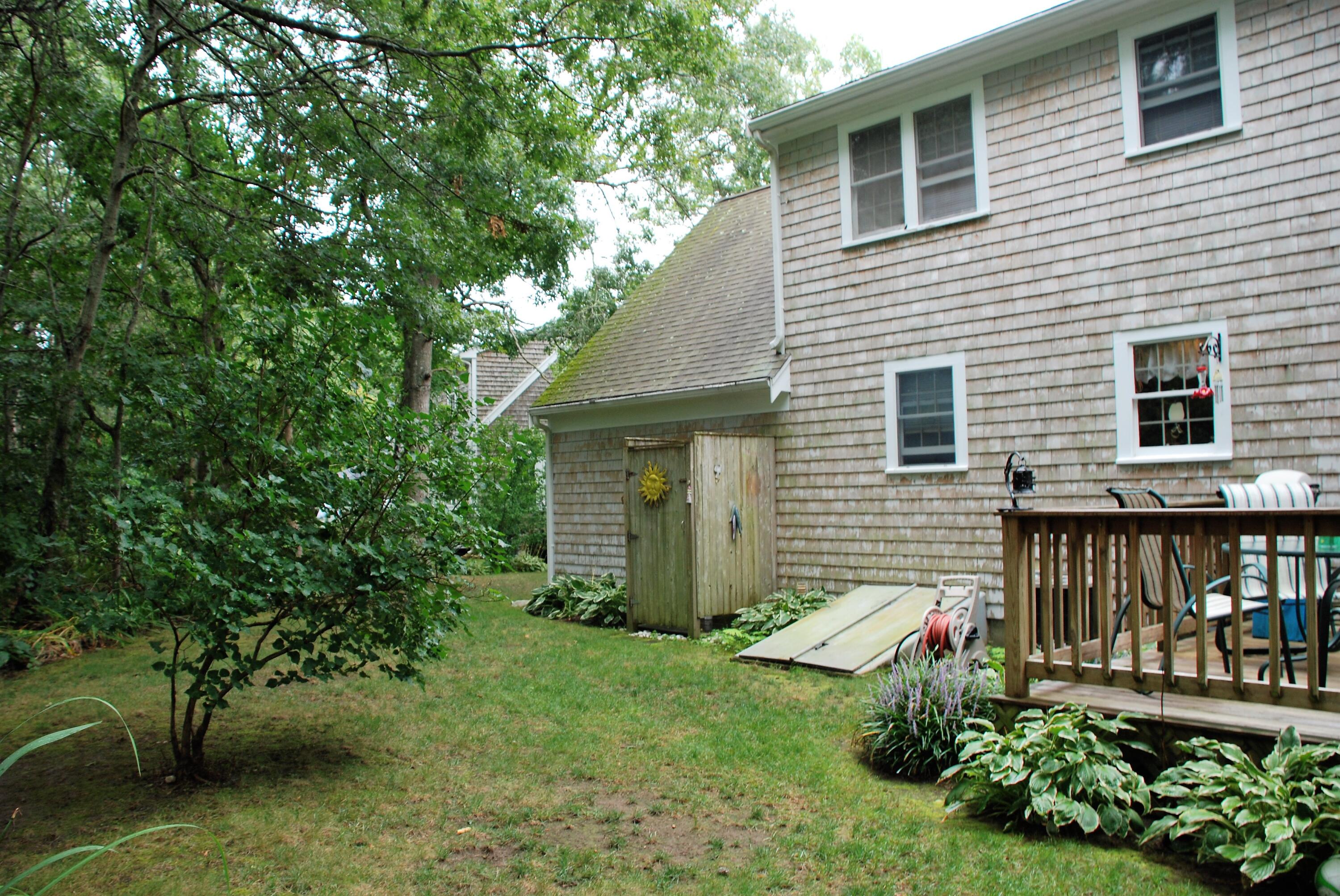 16 Skipjack Lane Hyannis, MA 02601 - Photo 29 of 39 a view of a house with a yard and plants