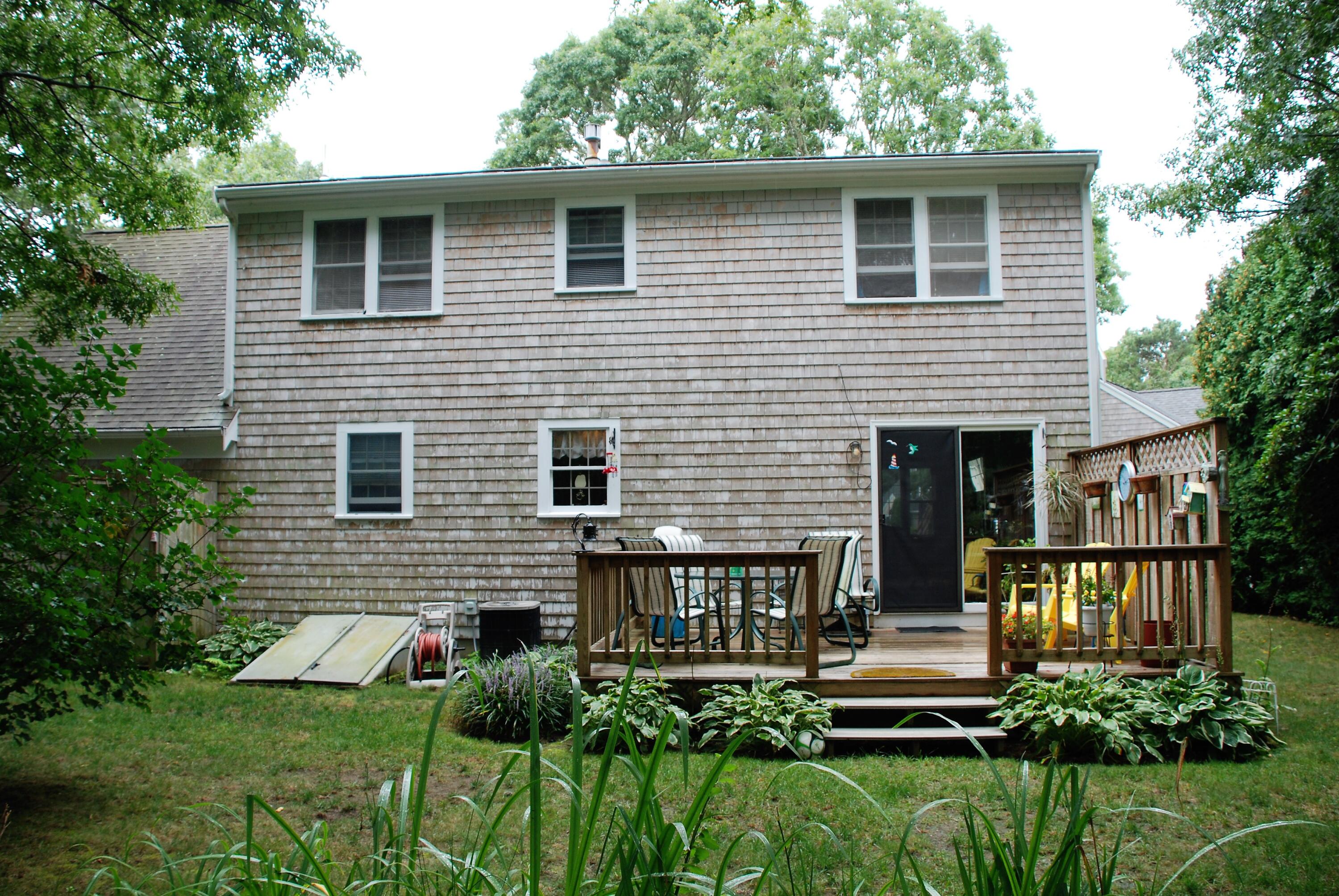 16 Skipjack Lane Hyannis, MA 02601 - Photo 30 of 39 a front view of house with yard and green space