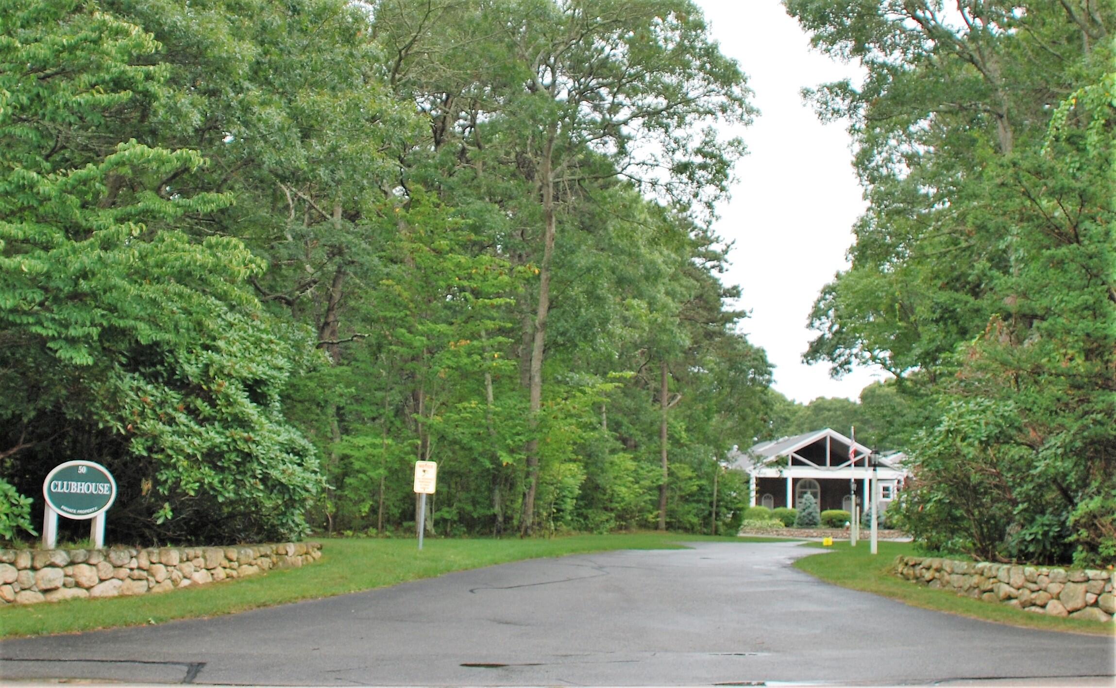 16 Skipjack Lane Hyannis, MA 02601 - Photo 34 of 39 a swimming pool with a trees in the background