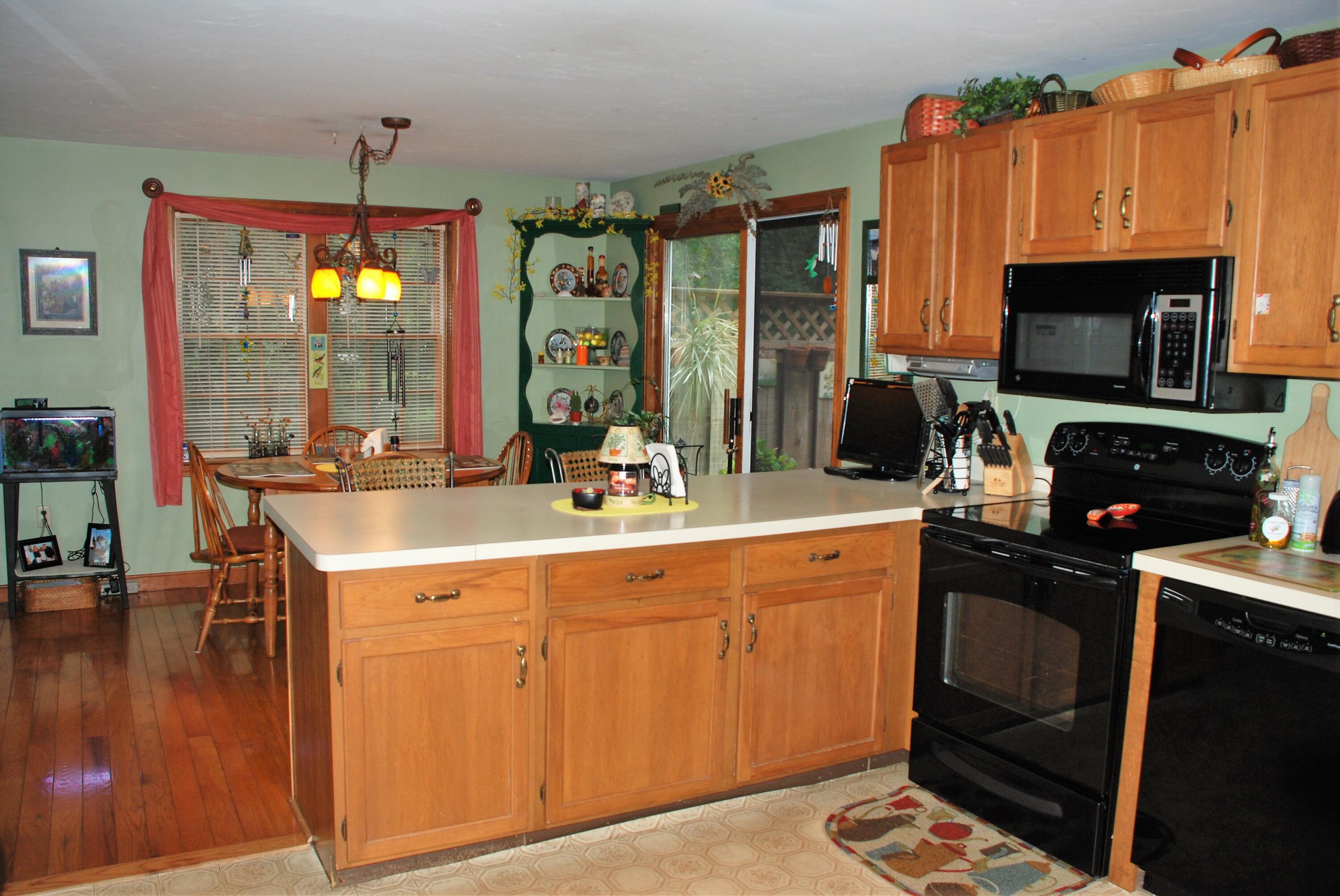 16 Skipjack Lane Hyannis, MA 02601 - Photo 10 of 39 a kitchen with a sink stove and microwave