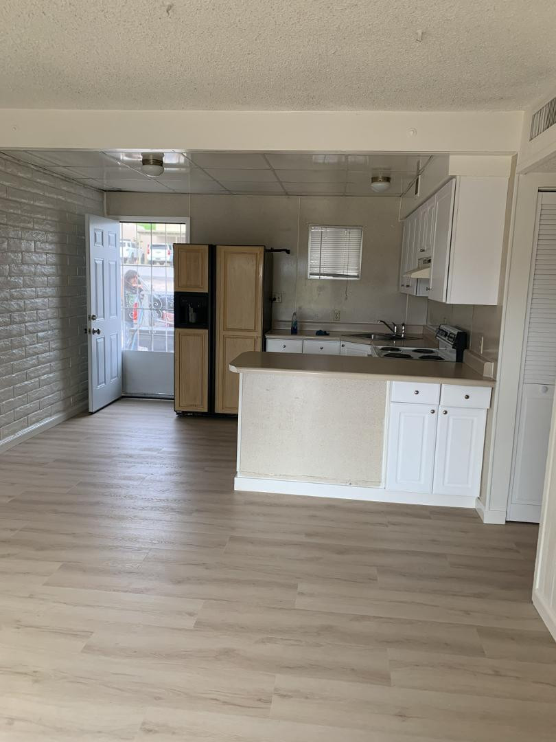 a view of a kitchen cabinets and wooden floor