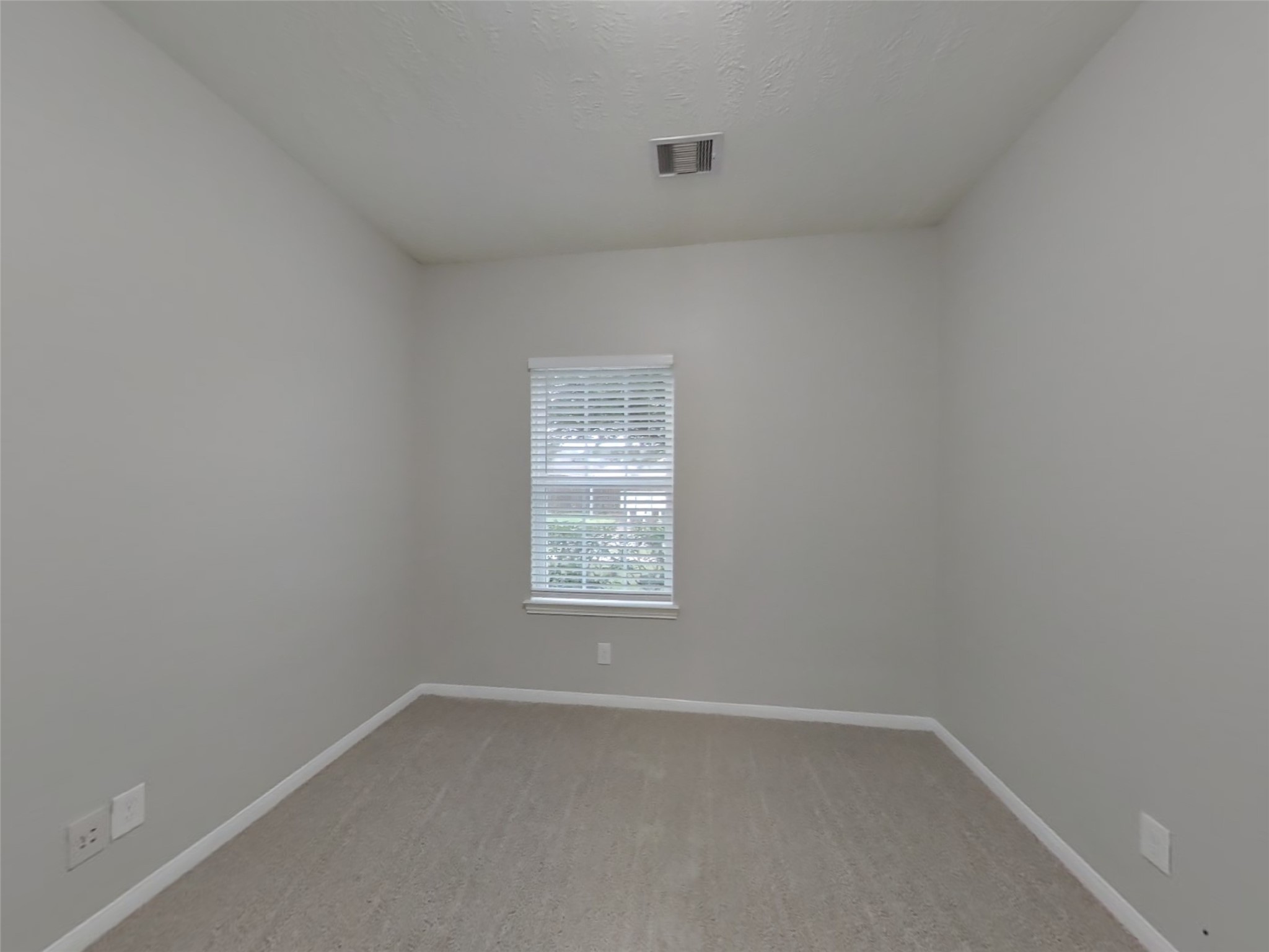 210 Pequin Road Crosby, TX 77532 - Photo 11 of 18 a view of an empty room with a window