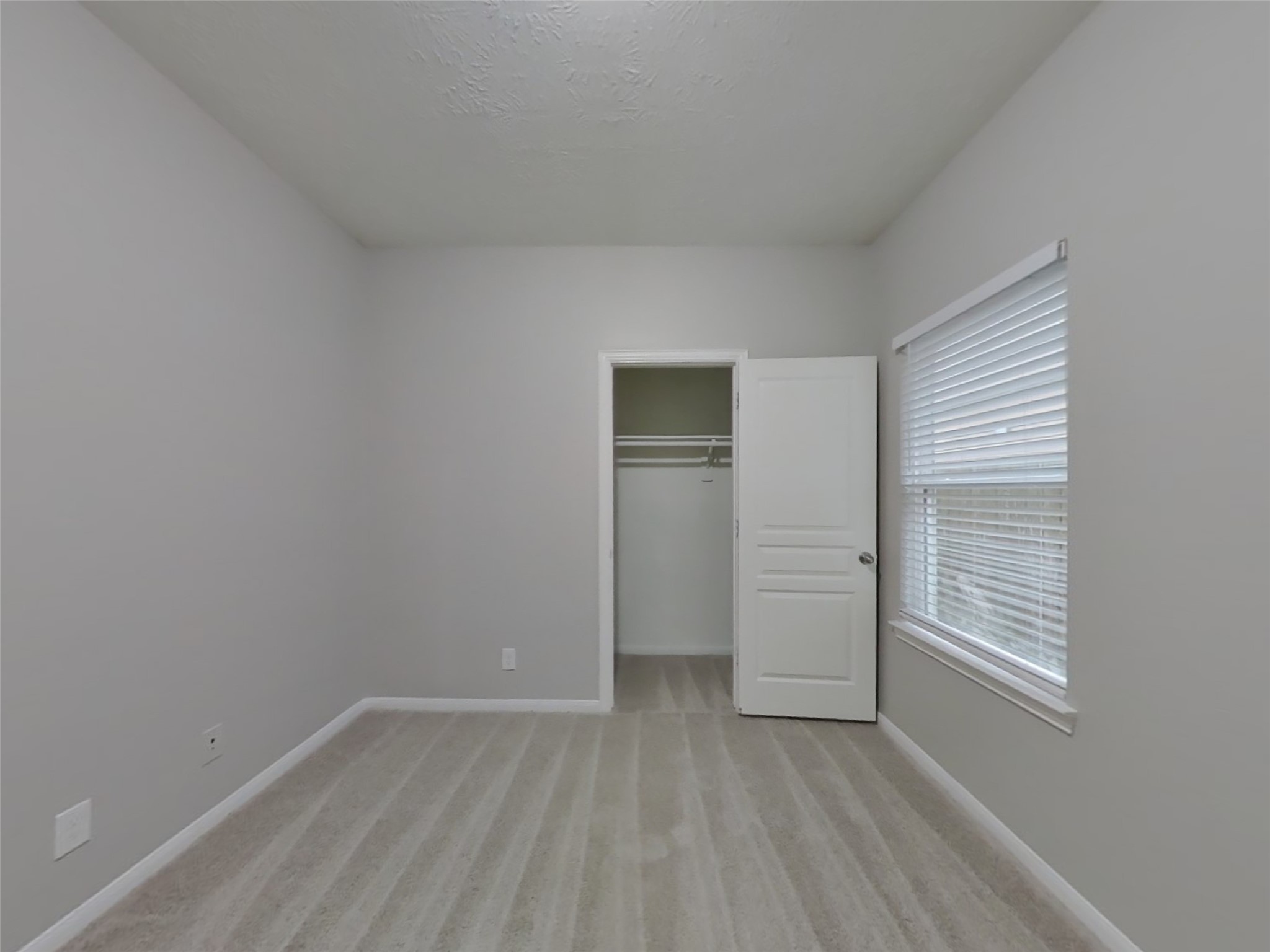 210 Pequin Road Crosby, TX 77532 - Photo 12 of 18 a view of an empty room with closet and a window