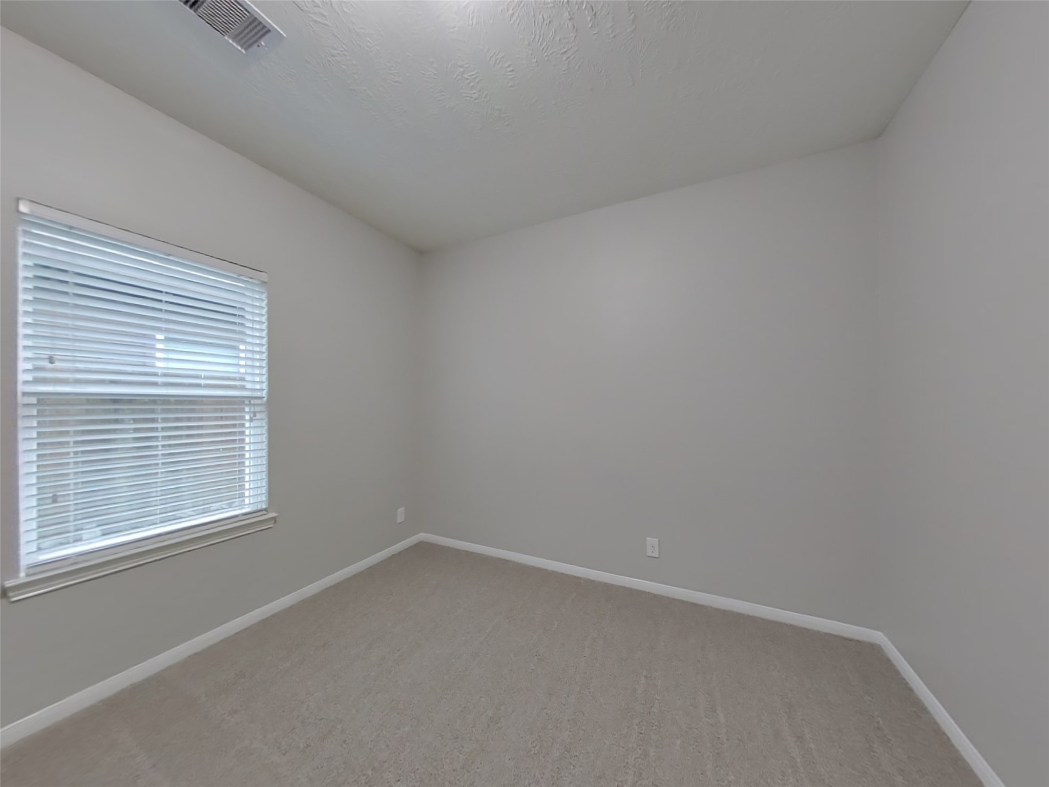 210 Pequin Road Crosby, TX 77532 - Photo 13 of 18 an empty room with a window