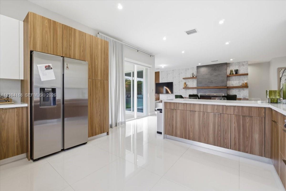 21205 Ingraham Ave Road Cutler Bay, FL 33189 - Photo 20 of 42 a kitchen with stainless steel appliances a refrigerator and a stove