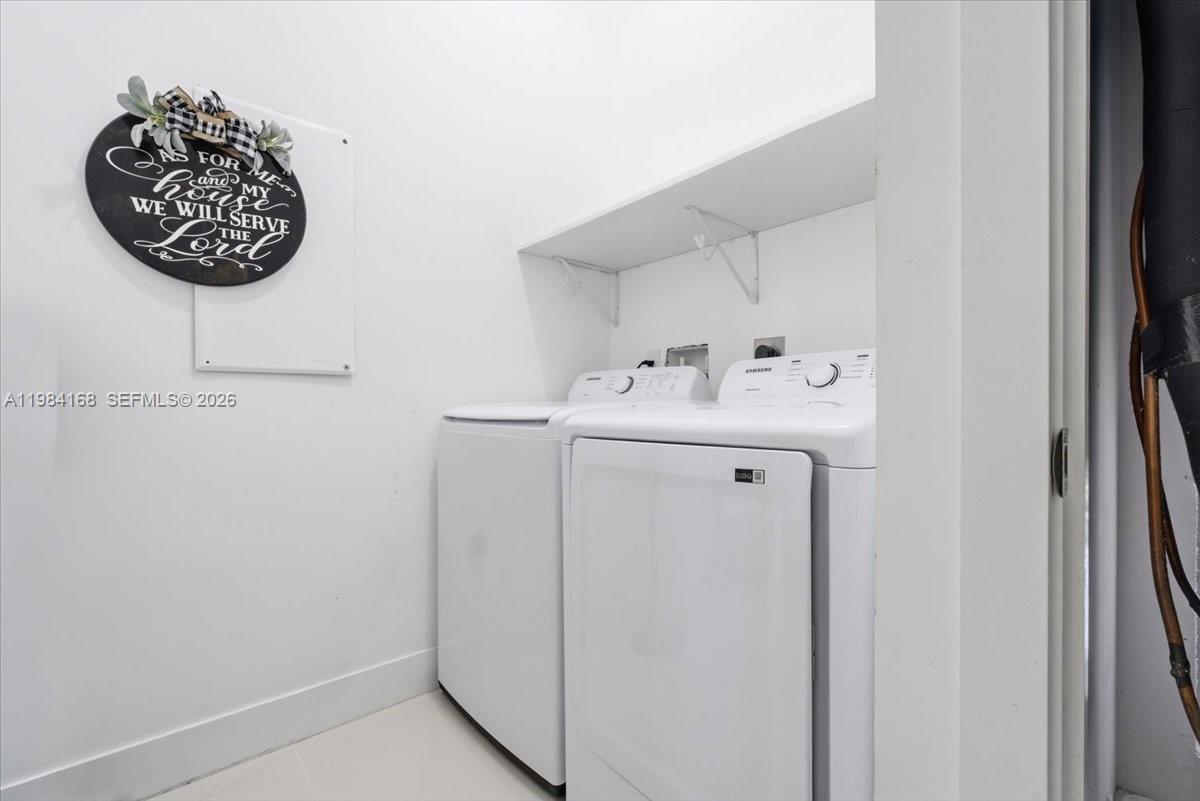 21205 Ingraham Ave Road Cutler Bay, FL 33189 - Photo 22 of 42 a utility room with dryer and washer