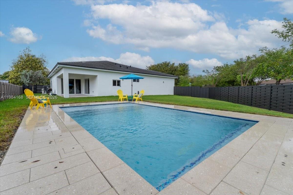 21205 Ingraham Ave Road Cutler Bay, FL 33189 - Photo 41 of 42 a view of swimming pool with a yard