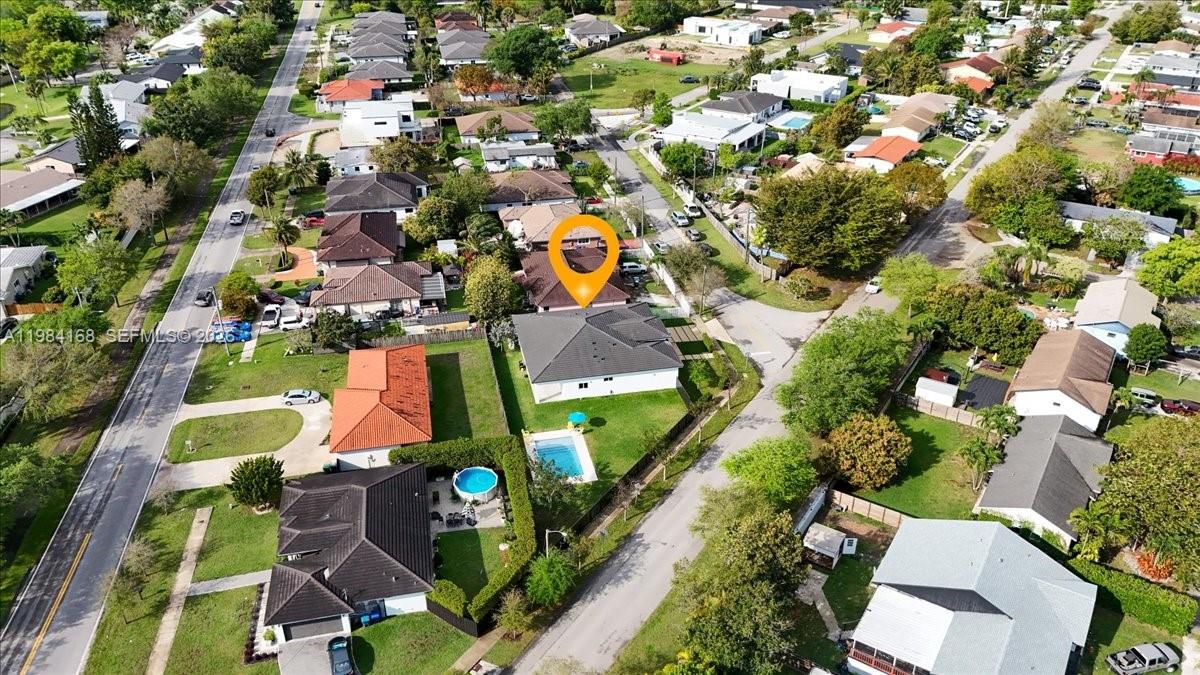 21205 Ingraham Ave Road Cutler Bay, FL 33189 - Photo 7 of 42 an aerial view of residential houses with outdoor space