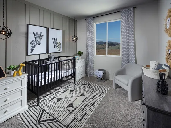 a bedroom with furniture and a window