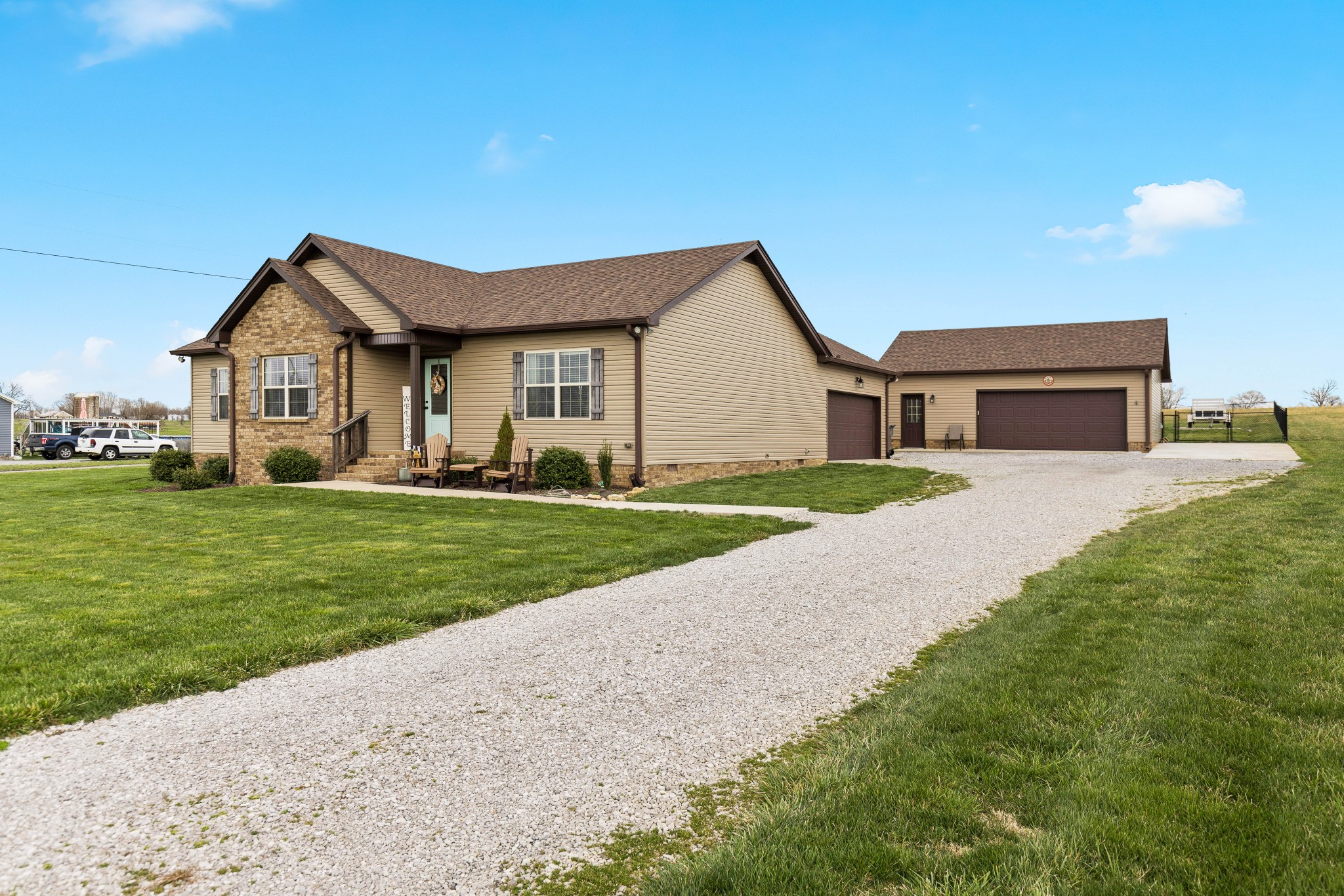 232 Piper Road Portland, TN 37148 - Photo 3 of 38 a front view of a house with a yard and garage