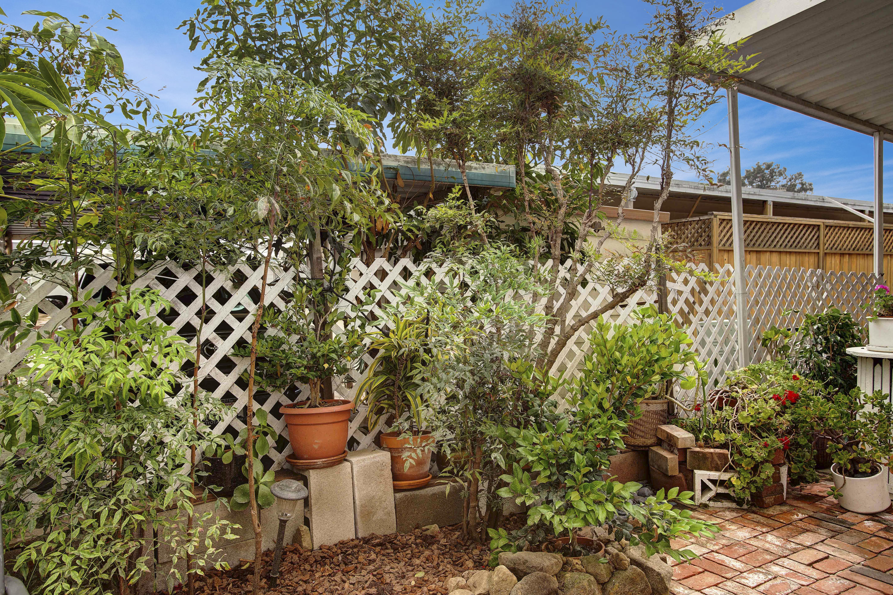 30 Winchester Canyon Road, Unit SPC 111 Goleta, CA 93117 - Photo 20 of 25 a garden view with a seating space