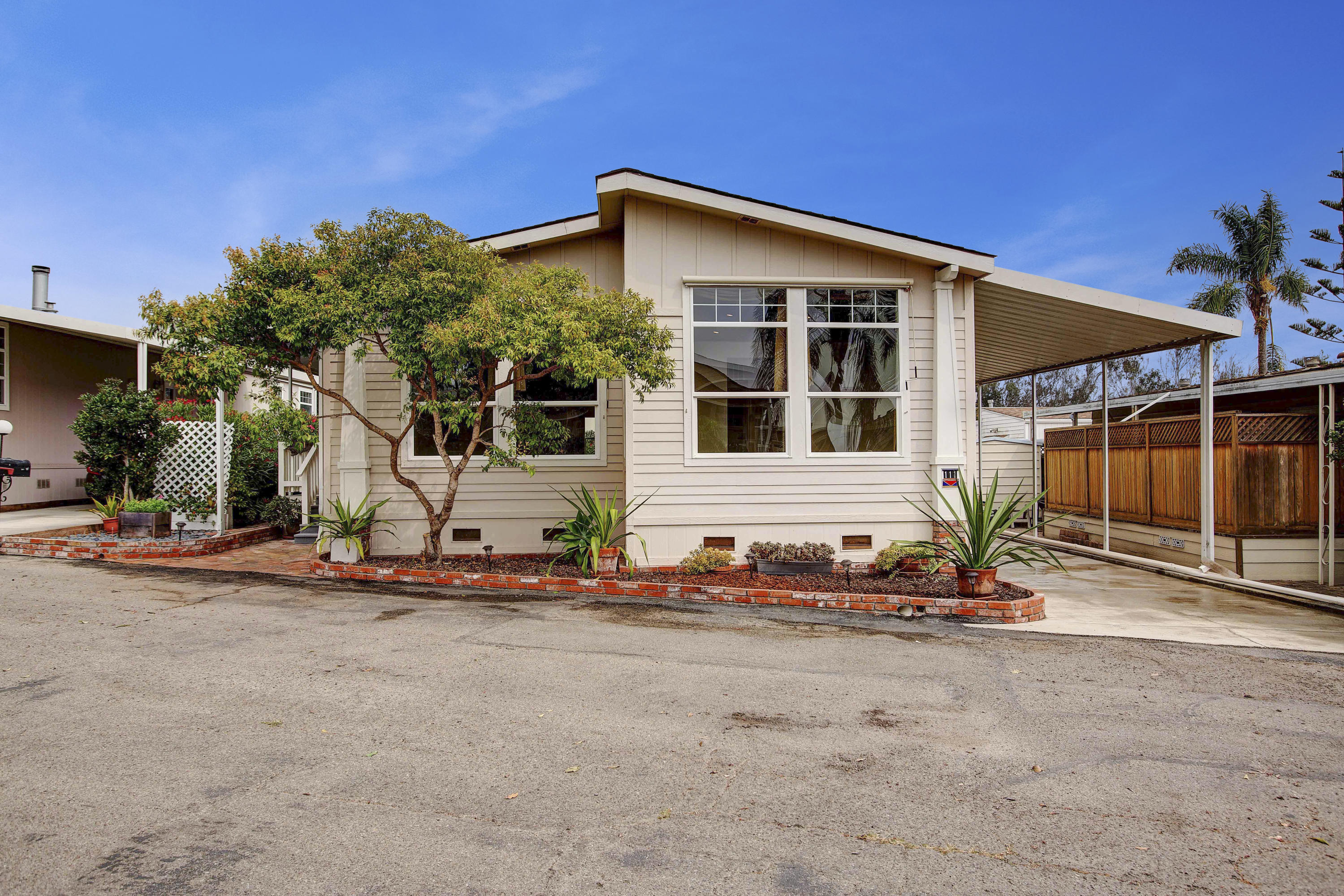 30 Winchester Canyon Road, Unit SPC 111 Goleta, CA 93117 - Photo 2 of 25 a front view of a house with a yard