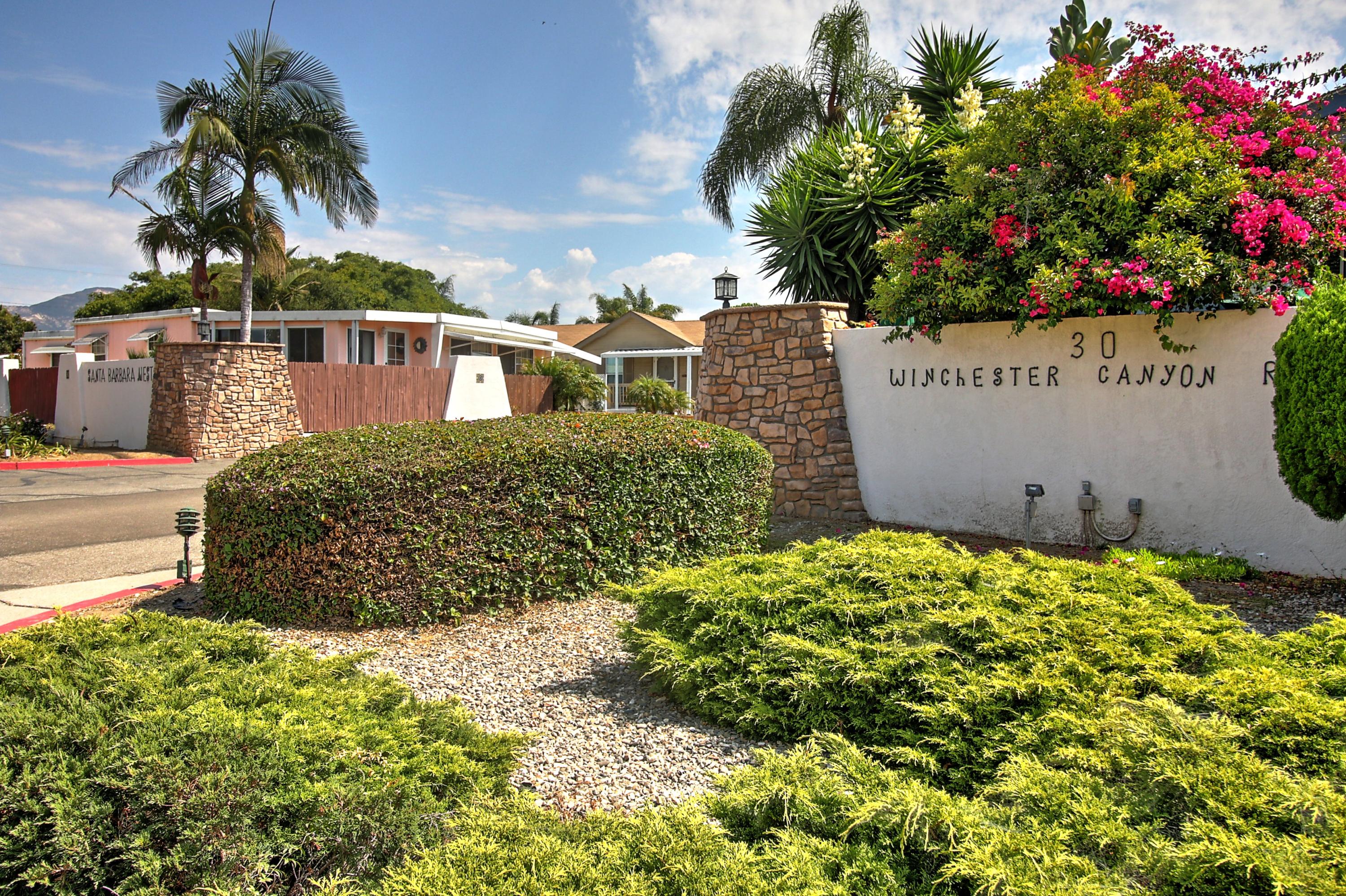 30 Winchester Canyon Road, Unit SPC 111 Goleta, CA 93117 - Photo 22 of 25 a view of a house with a flower garden