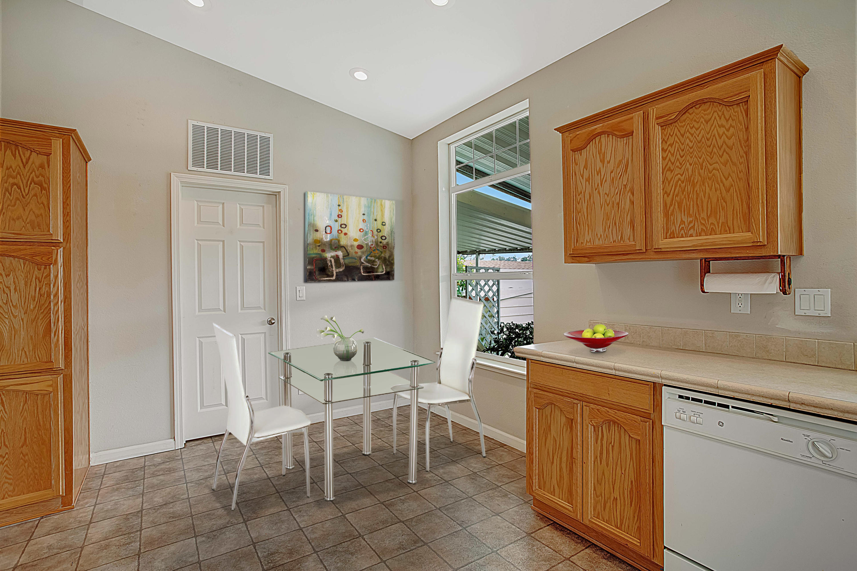 30 Winchester Canyon Road, Unit SPC 111 Goleta, CA 93117 - Photo 9 of 25 a kitchen with a cabinets and chairs in it