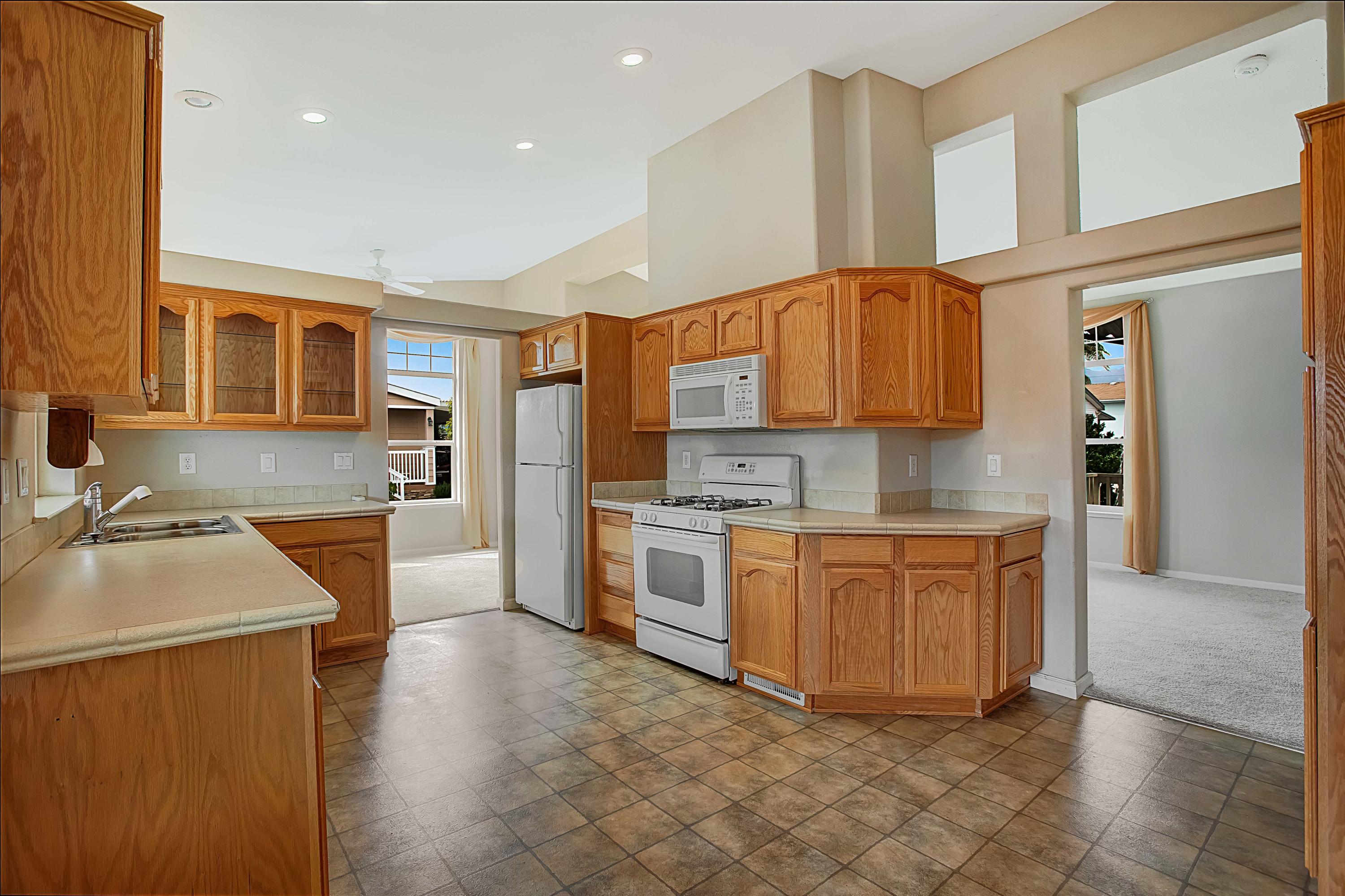 30 Winchester Canyon Road, Unit SPC 111 Goleta, CA 93117 - Photo 10 of 25 a kitchen with stainless steel appliances granite countertop a sink and a stove