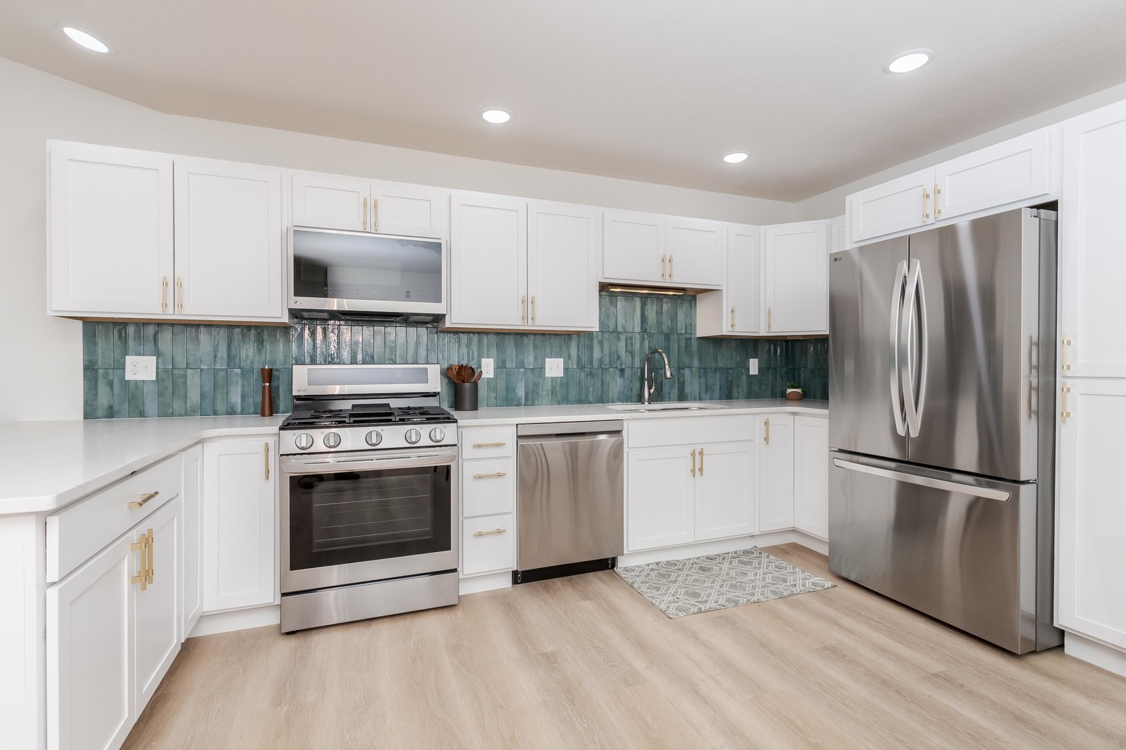 221 Cassidy Road Normal, IL 61761 - Photo 13 of 40 a kitchen with a refrigerator stove and white cabinets