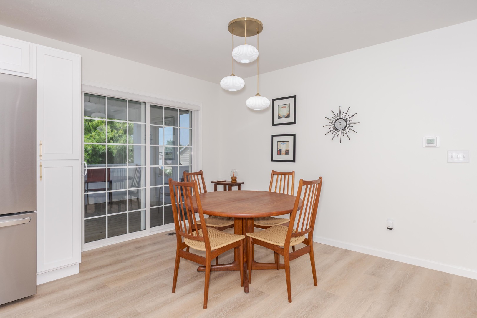 221 Cassidy Road Normal, IL 61761 - Photo 14 of 40 a view of a dining room with furniture and wooden floor