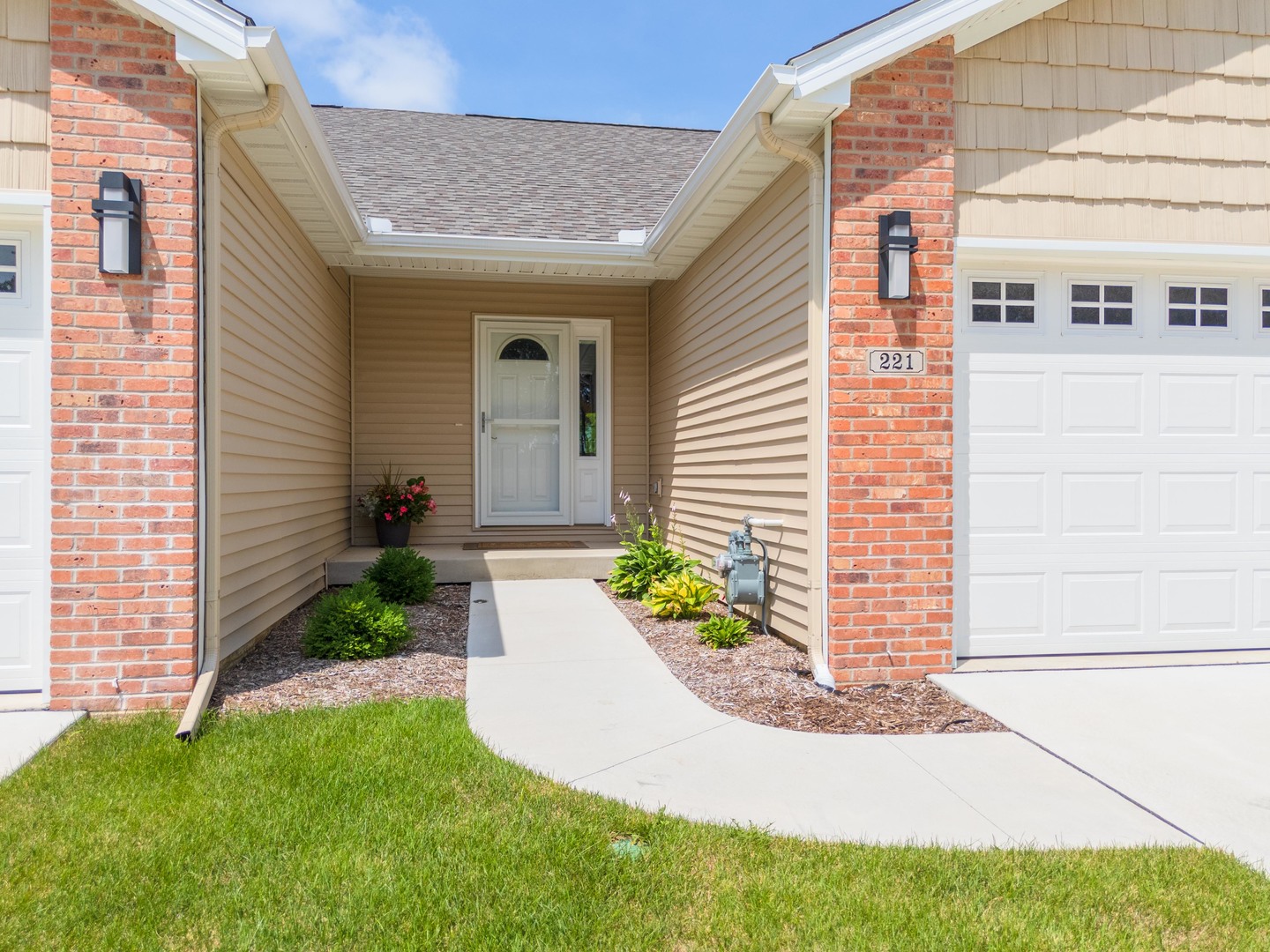221 Cassidy Road Normal, IL 61761 - Photo 2 of 40 a front view of a house with garden