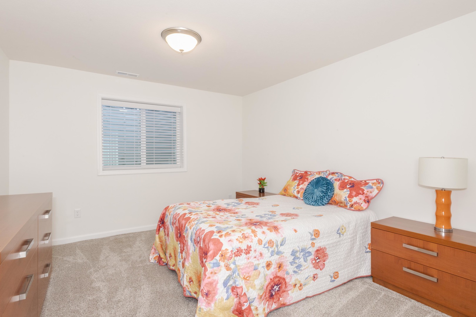 221 Cassidy Road Normal, IL 61761 - Photo 27 of 40 a bedroom with a bed and a lamp on dresser