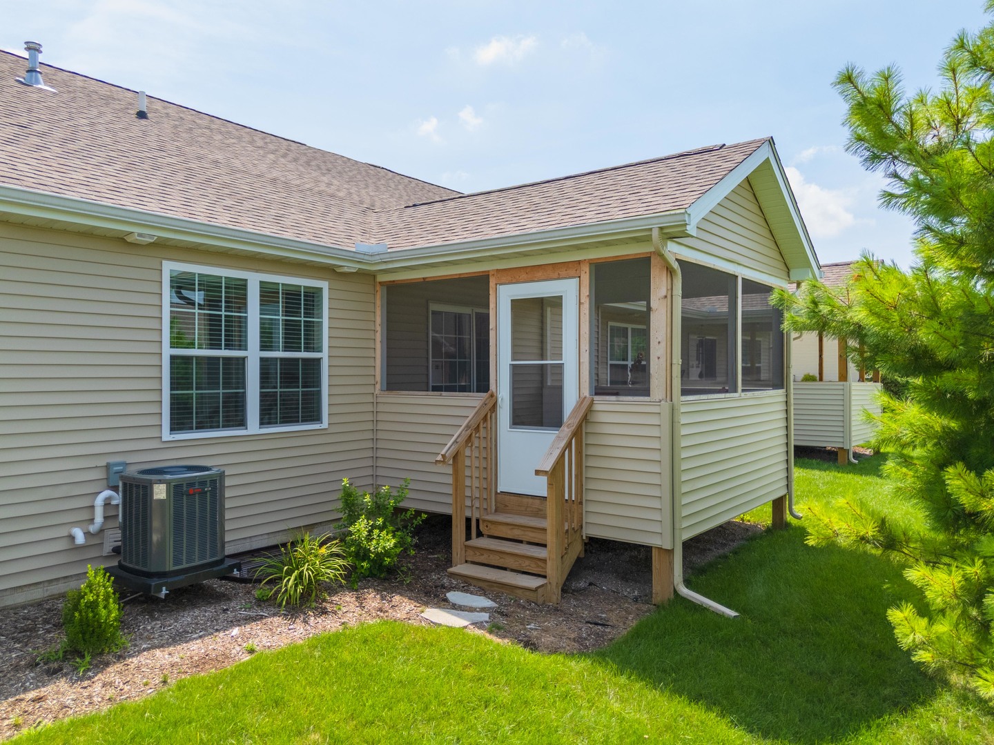 221 Cassidy Road Normal, IL 61761 - Photo 31 of 40 a view of a house with a yard and a garden