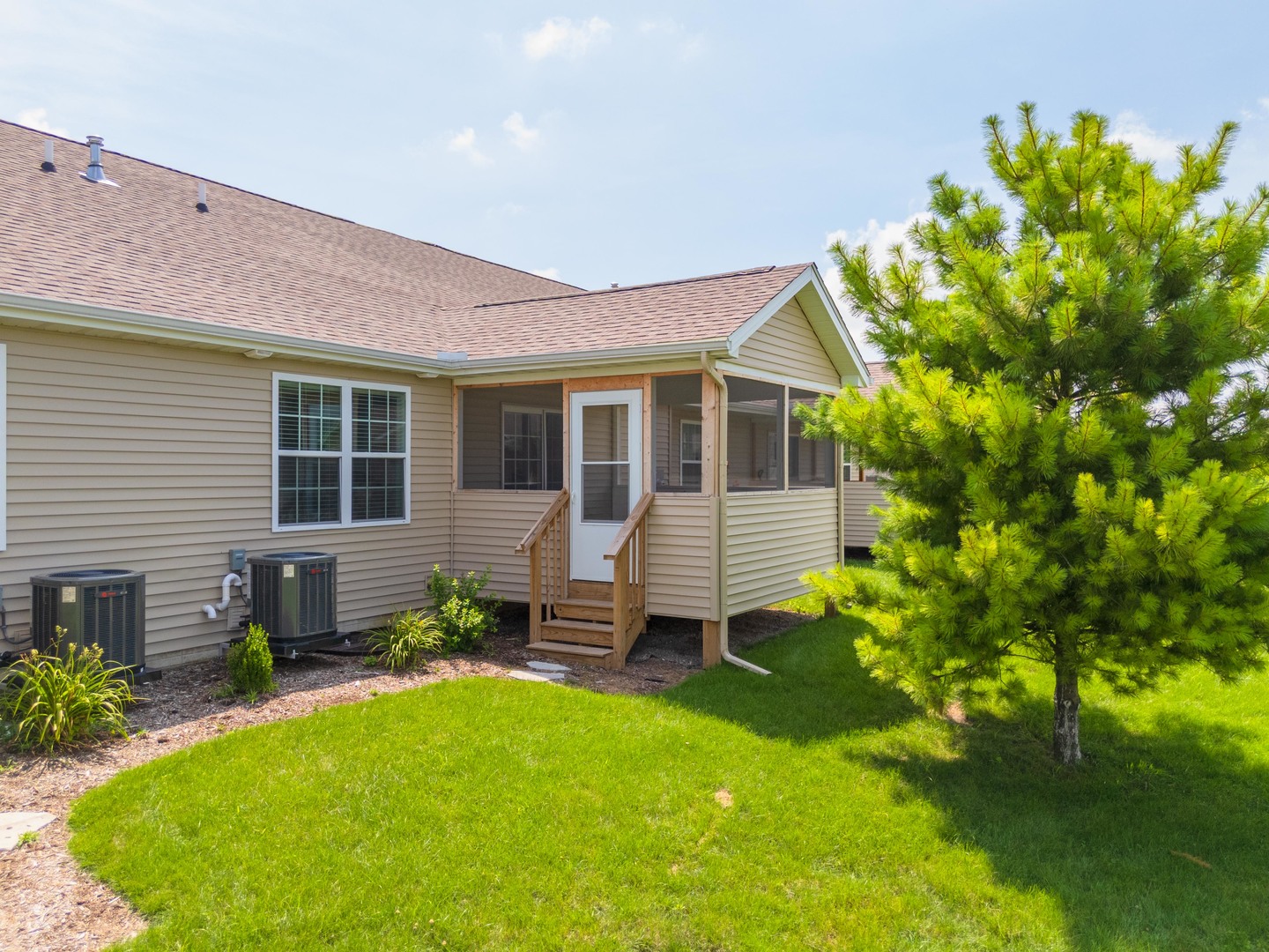 221 Cassidy Road Normal, IL 61761 - Photo 32 of 40 a front view of a house with garden