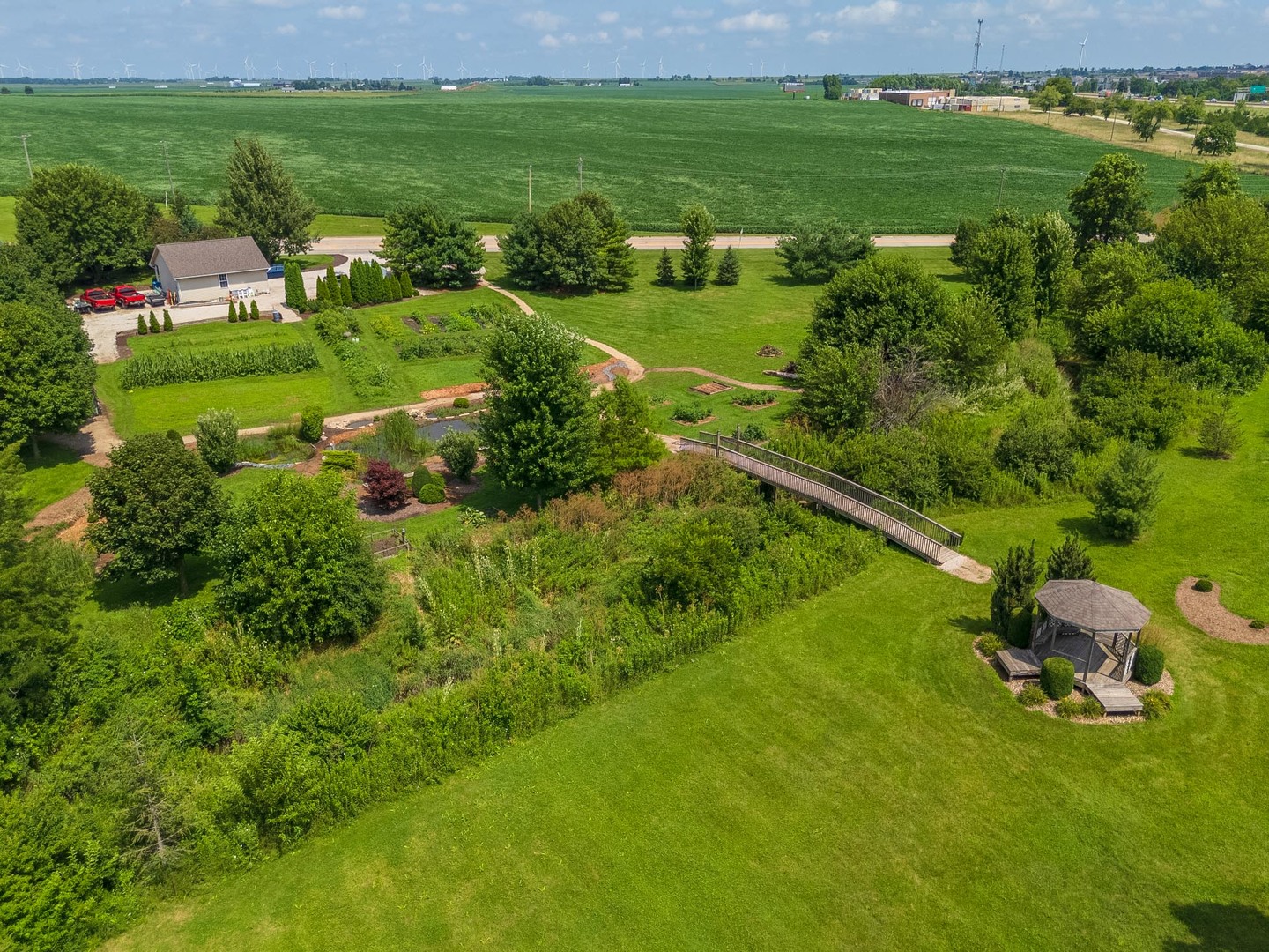 221 Cassidy Road Normal, IL 61761 - Photo 37 of 40 a view of a garden with a building in the background
