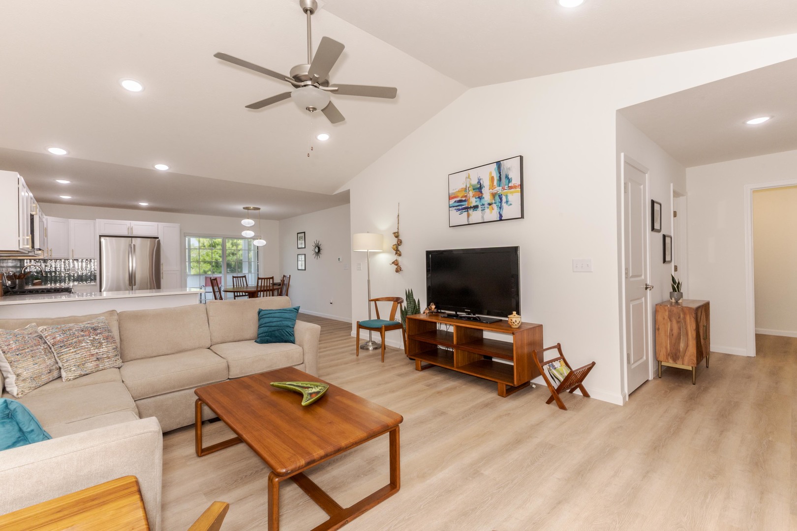 221 Cassidy Road Normal, IL 61761 - Photo 9 of 40 a living room with furniture and a flat screen tv with wooden floor