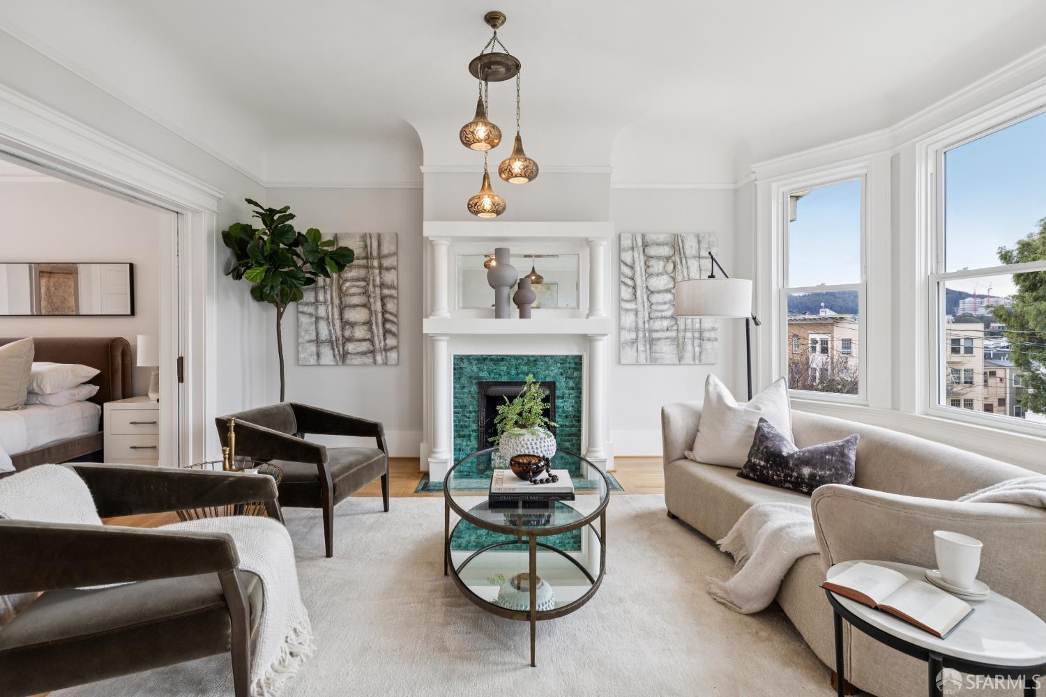 a living room with furniture a window and a fireplace