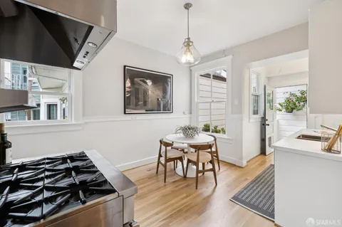 a view of parking garage with cars parked