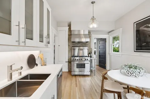 a view of a roof deck with furniture