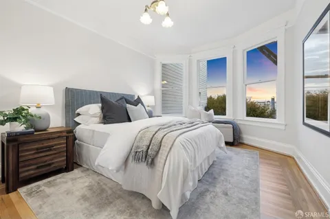 an aerial view of a house with outdoor space