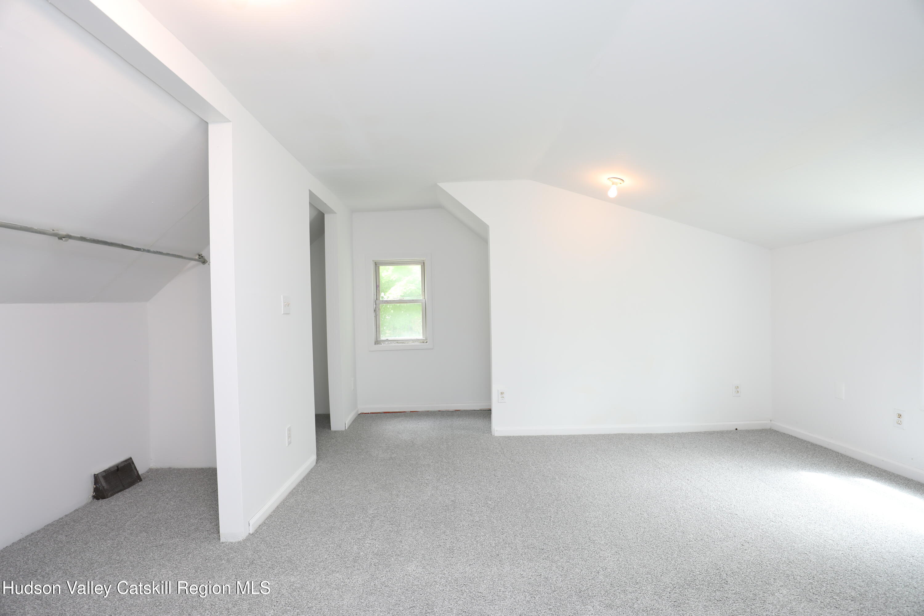 17 Rear Chapel Street, Unit 2 Ellenville, NY 12428 - Photo 15 of 20 an empty room with windows