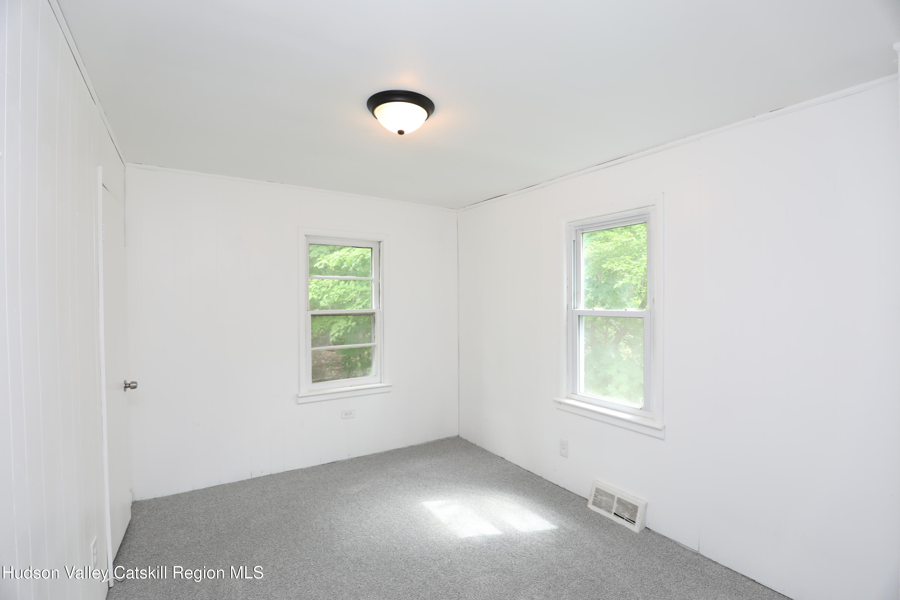 17 Rear Chapel Street, Unit 2 Ellenville, NY 12428 - Photo 10 of 20 an empty room with windows