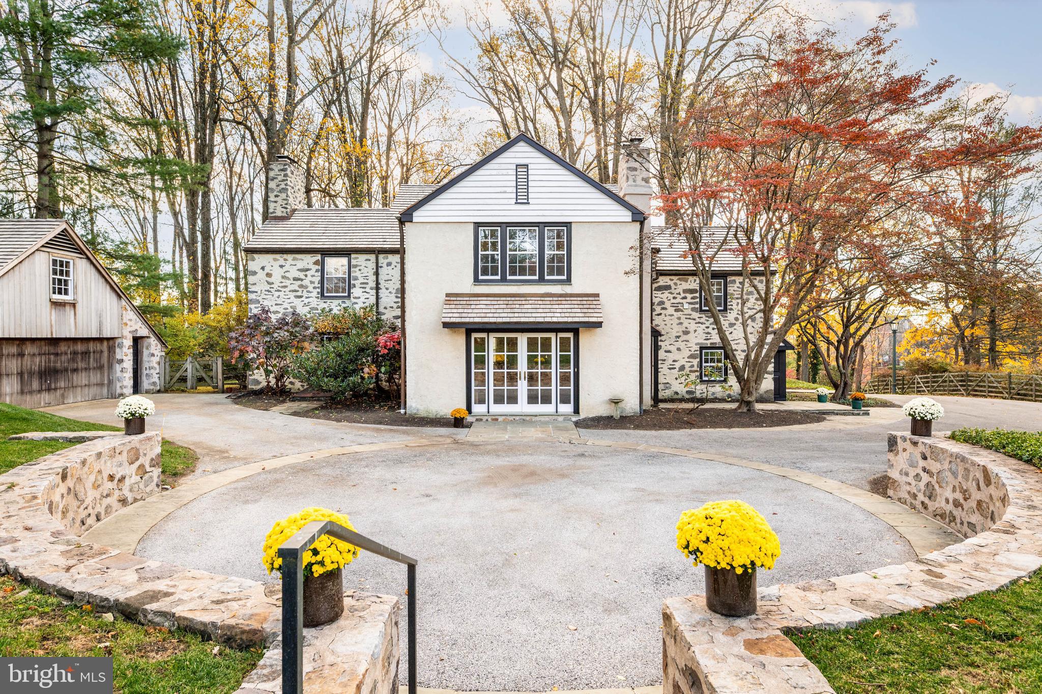 188 Abrahams Lane Villanova, PA 19085 - Photo 11 of 49 a front view of a house with a yard and garage