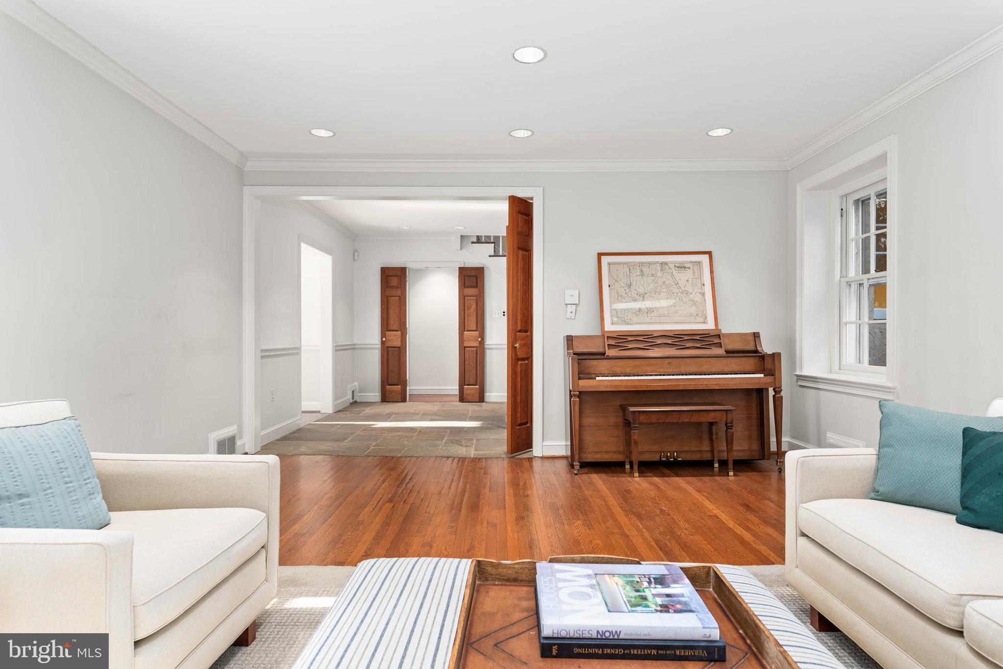 188 Abrahams Lane Villanova, PA 19085 - Photo 19 of 49 a living room with a couch and a piano next to a window