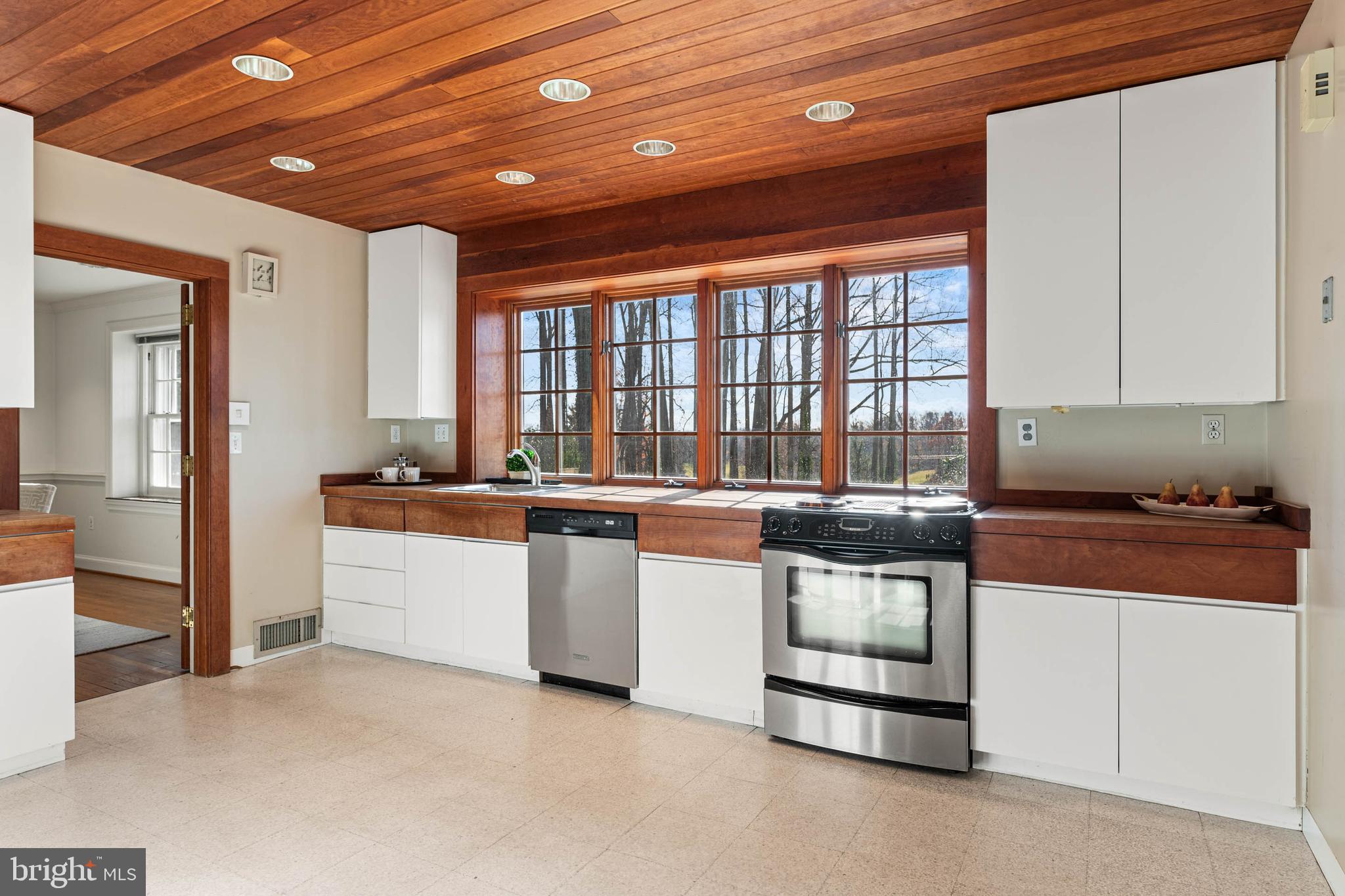 188 Abrahams Lane Villanova, PA 19085 - Photo 33 of 49 a large white kitchen with stainless steel appliances granite countertop a stove and a sink