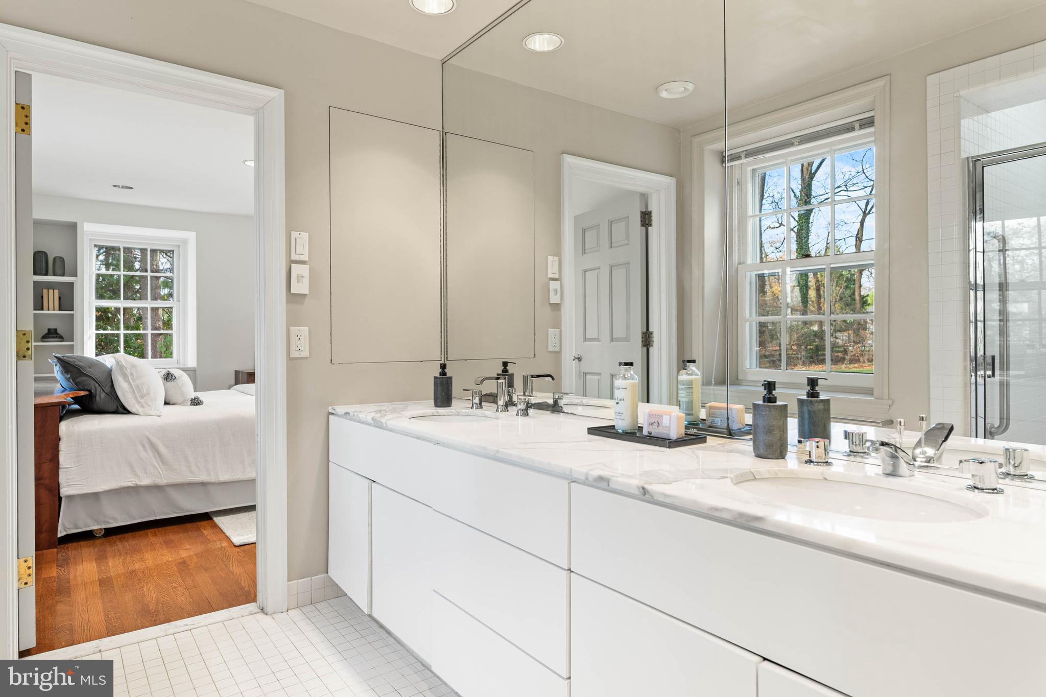 188 Abrahams Lane Villanova, PA 19085 - Photo 37 of 49 a bathroom with double vanity sinks and a mirror