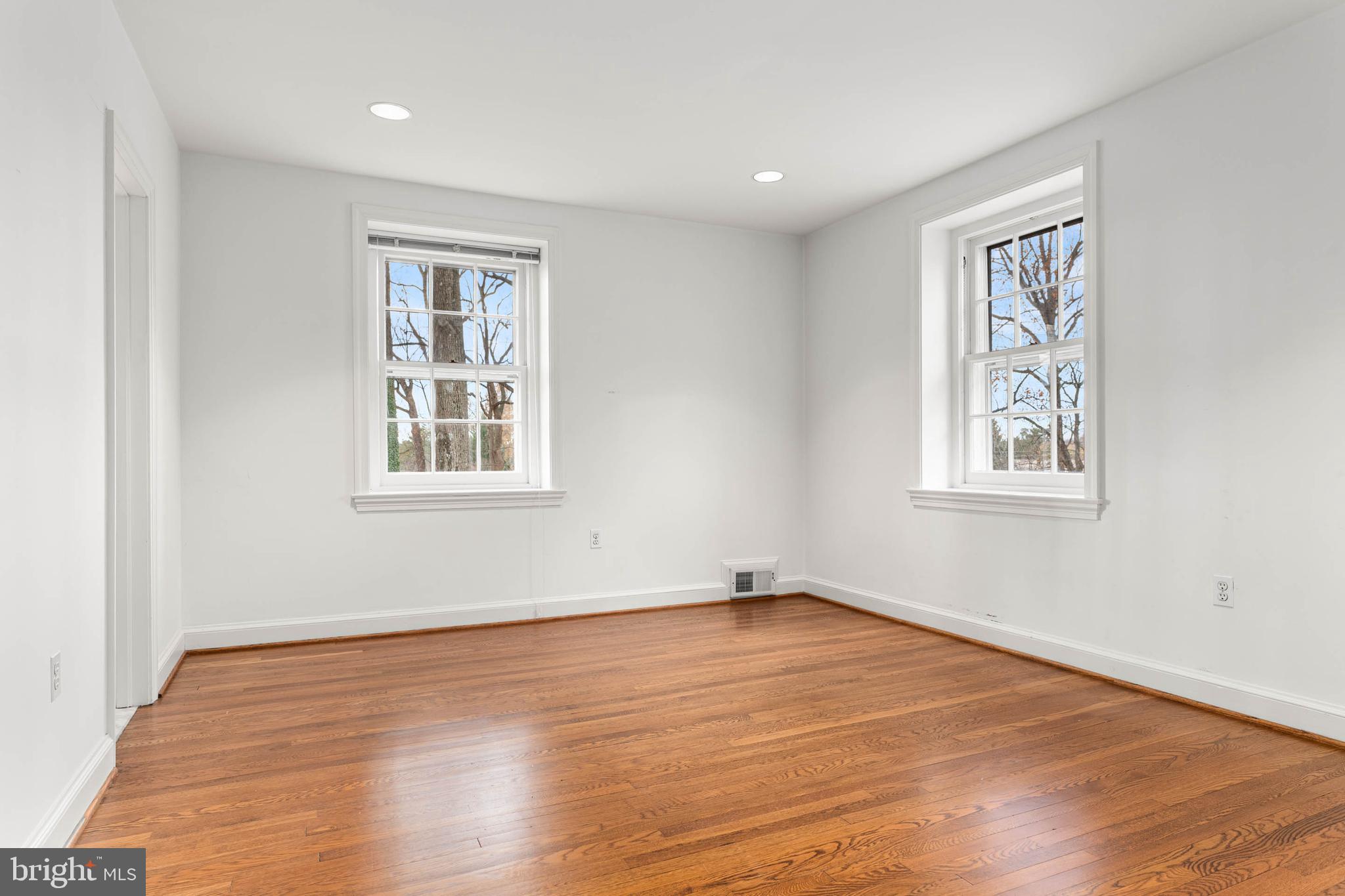 188 Abrahams Lane Villanova, PA 19085 - Photo 43 of 49 a view of an empty room with wooden floor and a window
